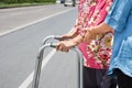 Senior woman using a walker cross street Royalty Free Stock Photo