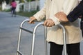 Senior woman using a walker cross street Royalty Free Stock Photo