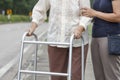 Senior woman using a walker cross street Royalty Free Stock Photo
