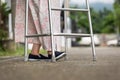 Senior woman using a walker on street. Royalty Free Stock Photo