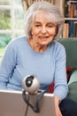 Senior Woman Using Webcam To Talk With Family Royalty Free Stock Photo