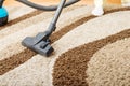 Senior woman vacuuming carpet at home Royalty Free Stock Photo