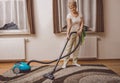 Senior woman vacuuming Royalty Free Stock Photo