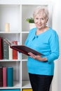 Senior woman viewing photo album Royalty Free Stock Photo