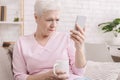 Senior woman with vision problems using phone Royalty Free Stock Photo