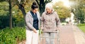 Senior woman, walker and nurse outdoor in a park with healthcare for elderly exercise. Walking, healthcare professional