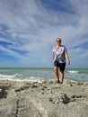 Senior woman walking on Captiva beach