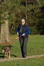 Senior woman walking dog Royalty Free Stock Photo