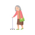 Senior woman walking with metal stick and green handbag