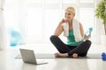 Senior Woman Watching Online Fitness Tutorials On Laptop While Training At Home Royalty Free Stock Photo