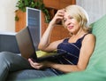 Senior woman watching soap show Royalty Free Stock Photo