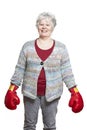 Senior woman wearing boxing gloves smiling Royalty Free Stock Photo