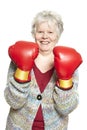 Senior woman wearing boxing gloves smiling Royalty Free Stock Photo