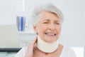 Senior woman wearing cervical collar with eyes closed Royalty Free Stock Photo