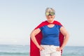 Senior woman wearing superwoman custome