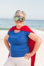 Senior woman wearing superwoman custome