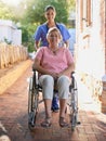 Senior woman, wheelchair and nurse in portrait for homecare, healthcare service and disability support outdoor Royalty Free Stock Photo