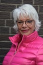 Senior woman with modish  pink duvet jacket Royalty Free Stock Photo