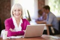 Senior Woman Working At Laptop In Contemporary Office Royalty Free Stock Photo