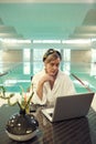 Senior Woman Working by Swimming Pool Royalty Free Stock Photo