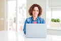 Senior woman working using computer laptop with a confident expression on smart face thinking serious Royalty Free Stock Photo