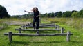 Jumping senior lady on fitness track Royalty Free Stock Photo