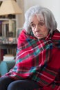 Senior Woman Wrapped In Blanket Unable To Afford Heating Bills