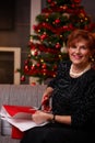 Senior woman wrapping presents at christmas Royalty Free Stock Photo