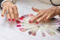 Senior womans hands with red manicure. Royalty Free Stock Photo