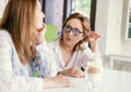 Senior women close friends sitting in cafe bar or restaurant  enjoying in conversation Royalty Free Stock Photo