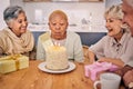 Senior women, friends and candles on birthday cake for a celebration, party and social gathering. Elderly people