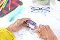 senior women hand using pulse oximeter Royalty Free Stock Photo