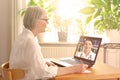 Senior woman doctor online consult coronavirus hotline