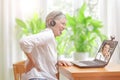 Woman back pain doctor video call Royalty Free Stock Photo