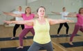 Active senior woman practicing yoga at group Royalty Free Stock Photo