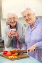 Senior women preparing meal together