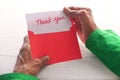 senior women& x27;s hand holding thank you letter , rear view Royalty Free Stock Photo