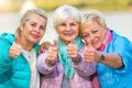 Senior women showing thumbs up Royalty Free Stock Photo