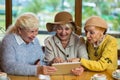 Senior women with tablet.