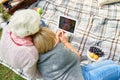 Senior Women Using Digital Tablet in Park Royalty Free Stock Photo