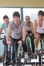 Senior women using spinning bikes Royalty Free Stock Photo