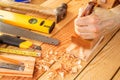 Senior woodworker or carpenter doing woodworking