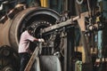 Senior worker in a dirty and old but still functioning metal works, old fashioned, factory Royalty Free Stock Photo