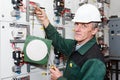 Senior worker standing near electrical panel Royalty Free Stock Photo