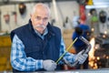 senior worker with tool Royalty Free Stock Photo