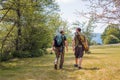 Senior and young fishermen on the river shore Royalty Free Stock Photo