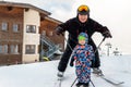 Senior young heart grandfather man with grandson toddler kid having fun enjoy skiing sport vacation on mountain peak