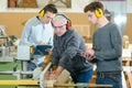 senior and young men - woodwork apprenticeship Royalty Free Stock Photo