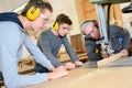 Senior and young men - woodwork apprenticeship Royalty Free Stock Photo