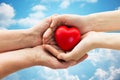 Senior and young woman hands holding red heart Royalty Free Stock Photo